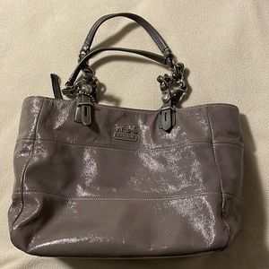 Grey patent leather Coach tote. Minor scuffing on top right of bag. Gently used